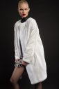 Collarless white mink coat with swakara sleeves