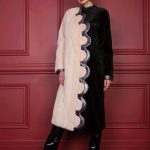 Collarless let-out peach mink & black shorn mink long coat with dramatic curves