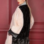 Peach color mink & Swakara jacket with ruffled elasticated back hem & hand crafted leather seams in narrow strips