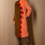 Collarless let-out Cooper & Amber glow mink long coat with dramatic curves