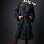 Swakara long coat collarless in Navy Blue color with C-shape draped sleeves
